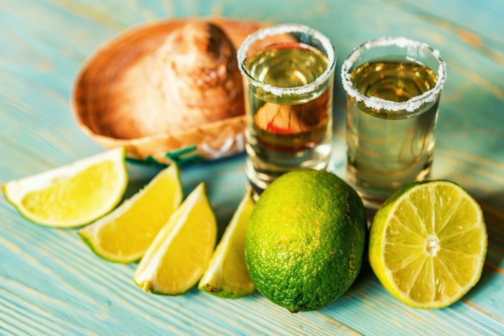 Tequila with lime and salt, selective focus